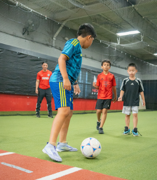 Young players training on NexGen indoor soccer turf