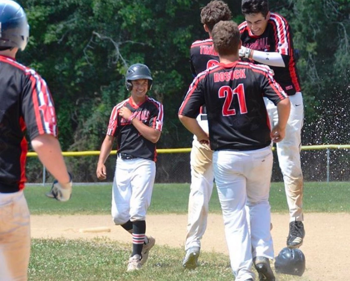 NexGen travel team celebrating at home plate